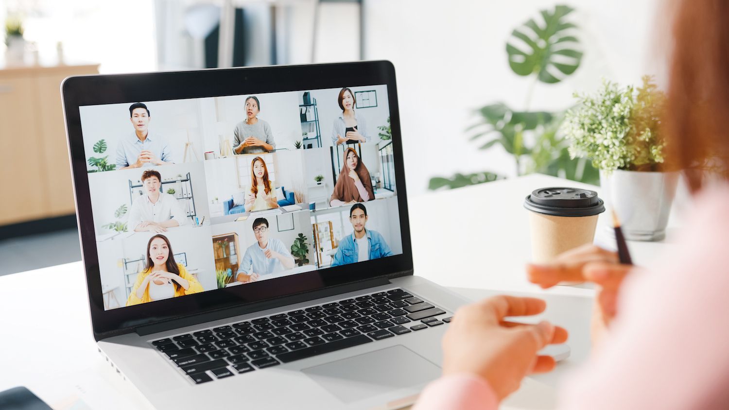 Man and woman looking over a laptop